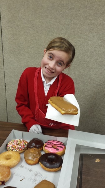 Handing out Doughnuts After Mass