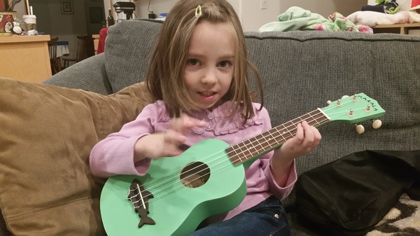 Playing her Ukulele